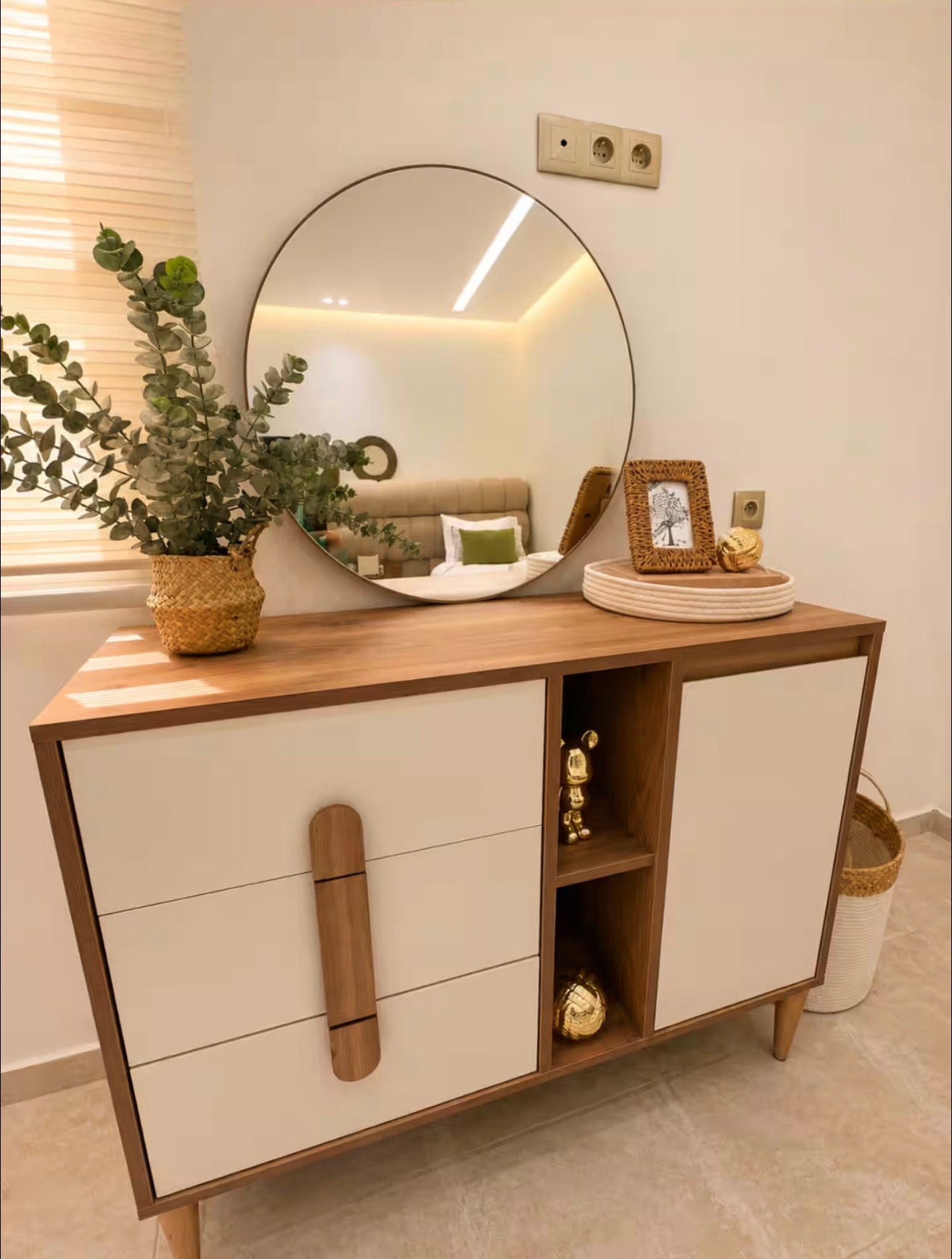 Bedroom vanity area in DHAJIA Tilila, Agadir apartment with mirror, storage and refined styling.