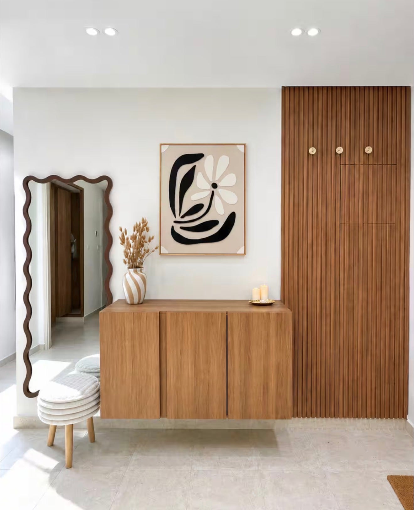 Hallway console and mirror in DHAJIA Tilila, Agadir apartment with clean designer styling.