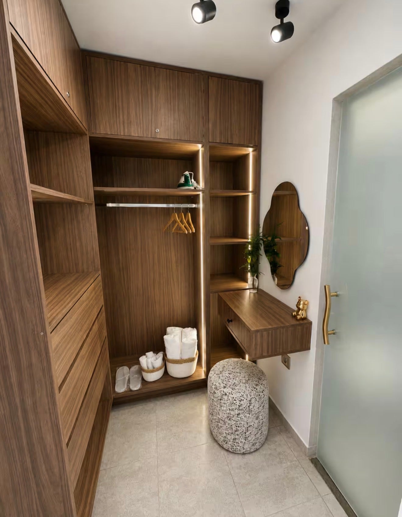 Wardrobe and storage area in DHAJIA Tilila, Agadir apartment with clean modern finish.
