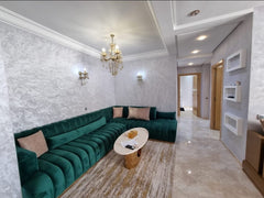 Living area with green sofa — Résidence Elkatani, Les Jardins d’Agadir, 79 m²