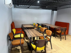 Peri Peri Grill dining area with colourful chairs and orange booth seating, Agadir Bay