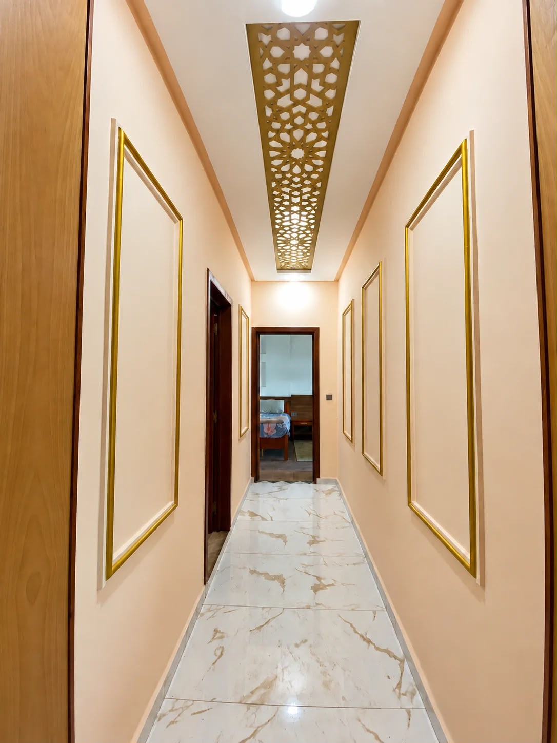 Entrance hallway with marble-look floor and decorative ceiling in the presidential apartment, Agadir