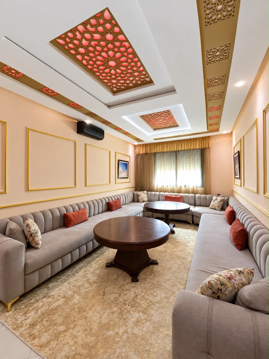Grand Moroccan salon with long sofas and illuminated decorative ceiling in the presidential apartment, Agadir
