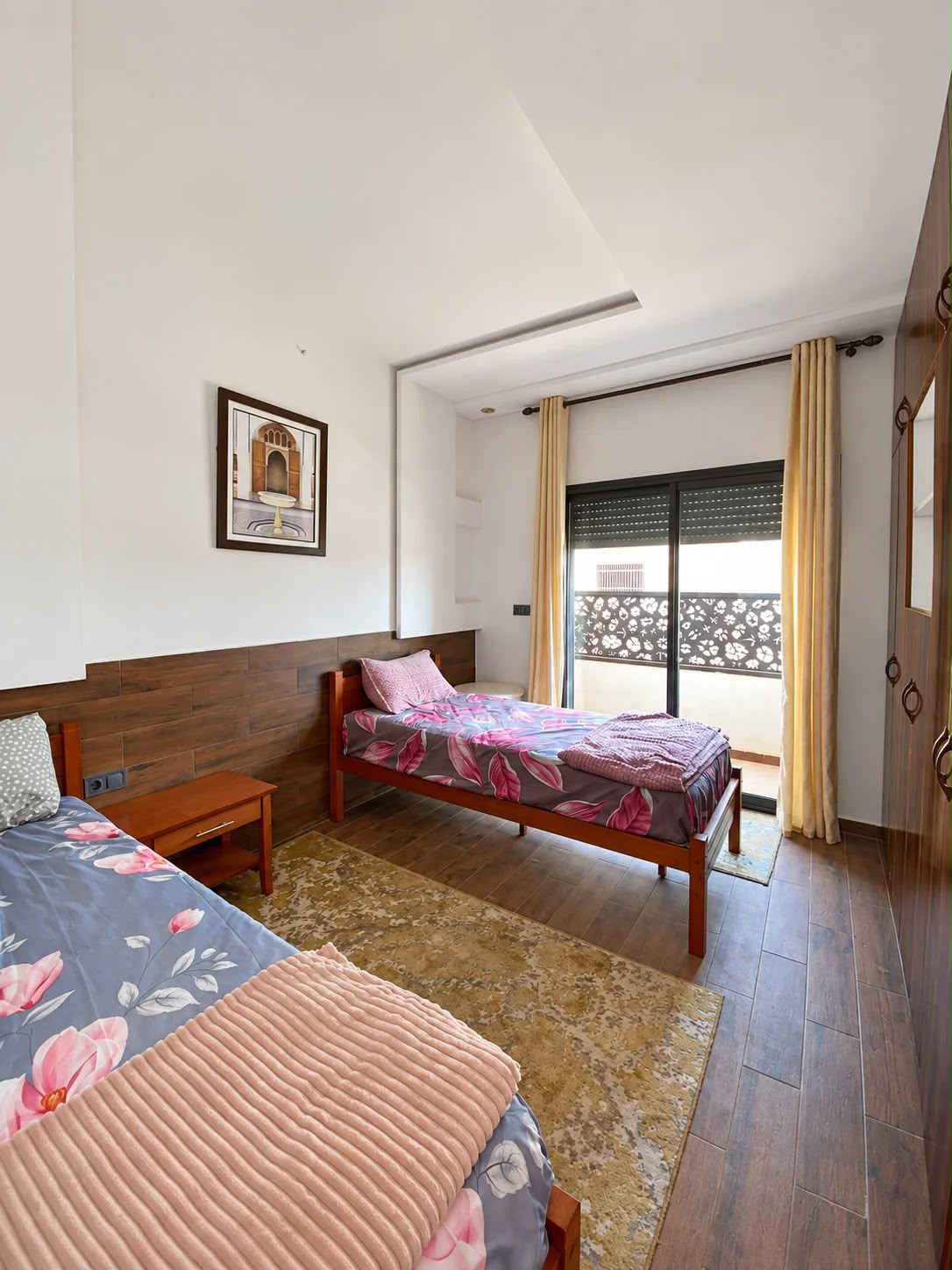 Twin bedroom with two single beds and window in the presidential apartment, Agadir