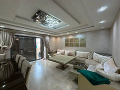 Elegant lounge opening directly onto the private garden at Iken Gardens, Agadir Bay.