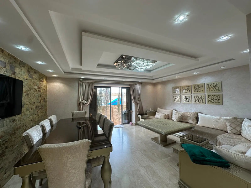 Spacious living and dining room with garden access at Iken Gardens, Agadir Bay.