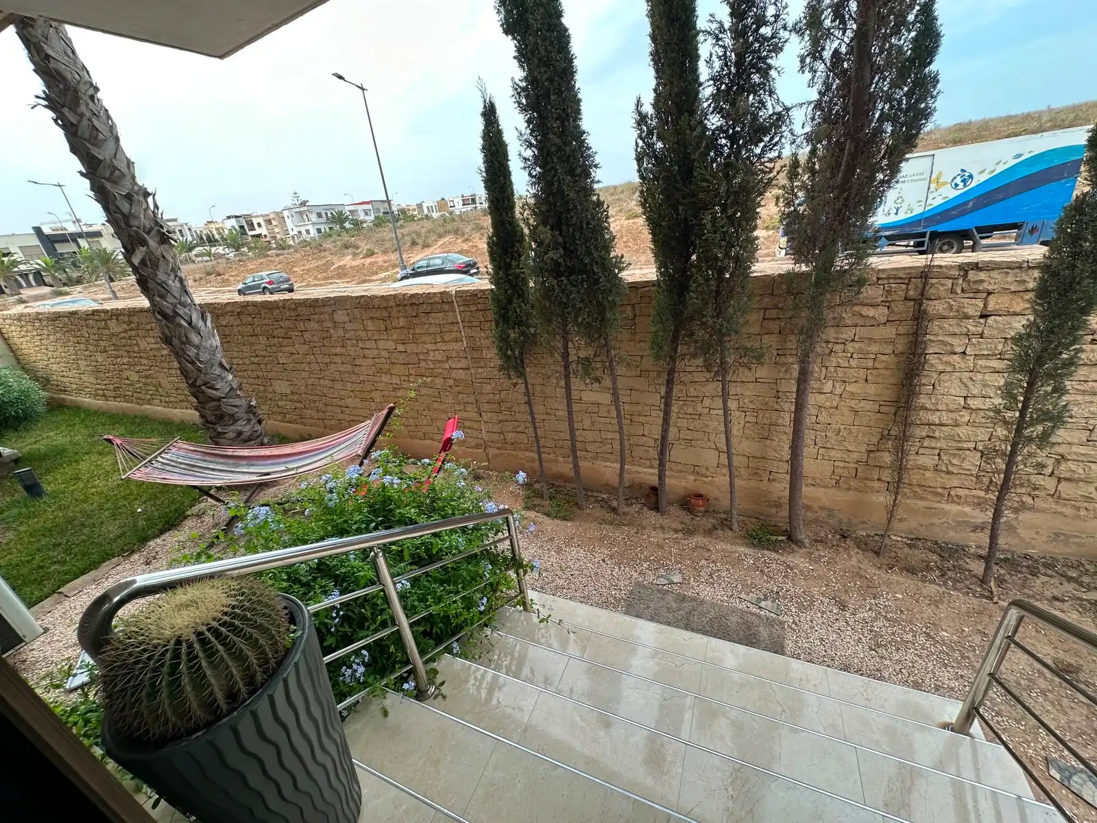 Private garden with hammock and mature planting at Iken Gardens, Agadir Bay.