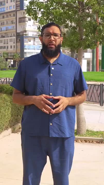 DHAJIA presenter in blue discussing property in Agadir